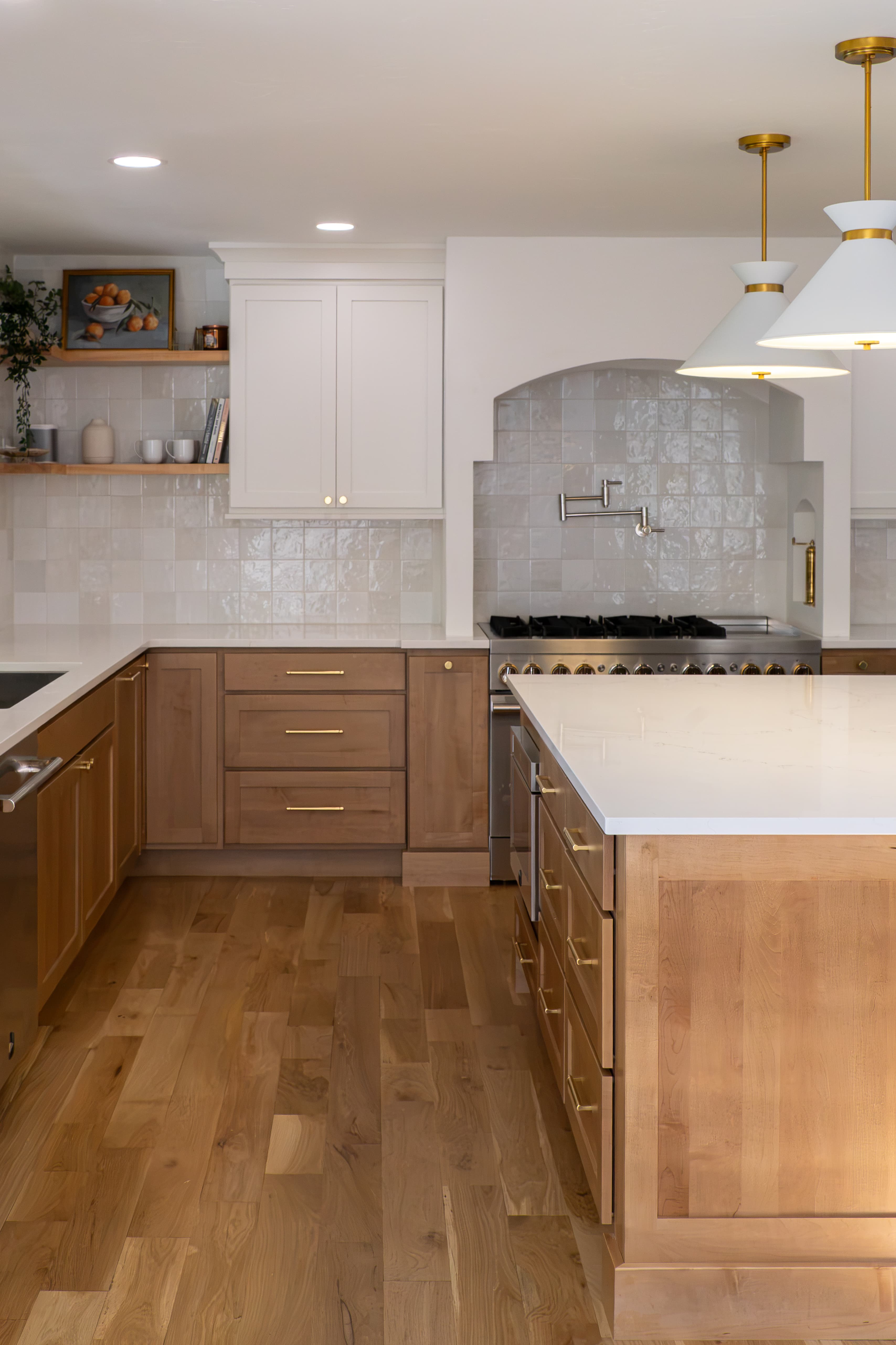 Two-toned kitchen with maple lower cabinets, quartz counters, and zellige-look tile backsplash near the Denver Tech Center