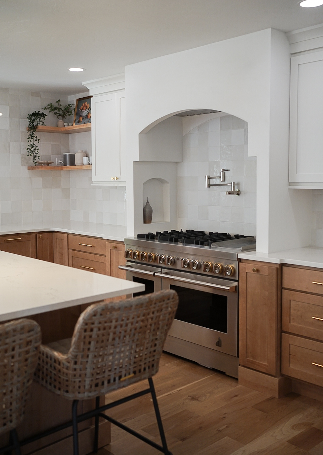 Greenwood Village kitchen detail with natural stone and warm finishes by Halcyon Haus