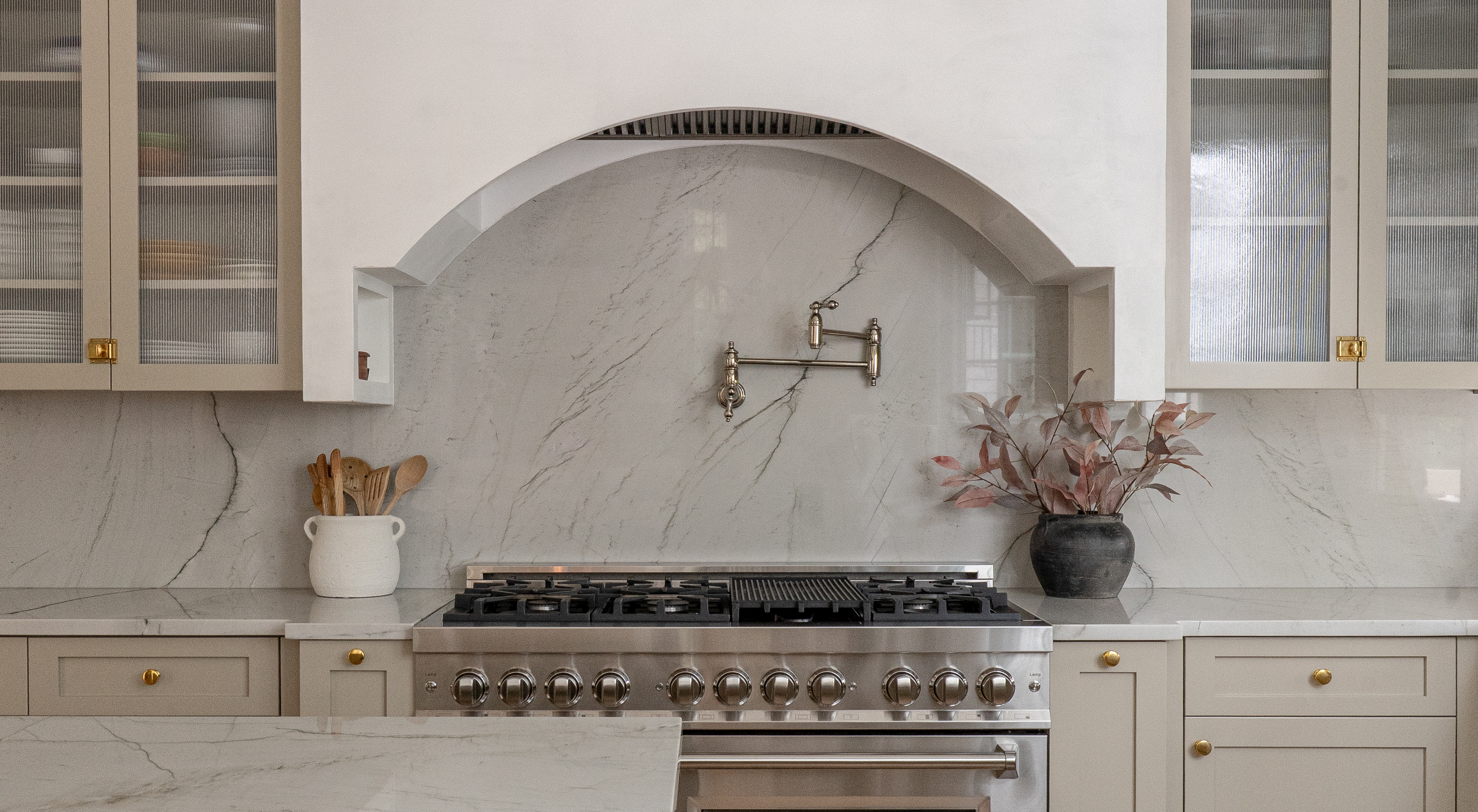 Castle Pines kitchen with Benjamin Moore Pashmina cabinets and Venetian plaster range hood by Halcyon Haus