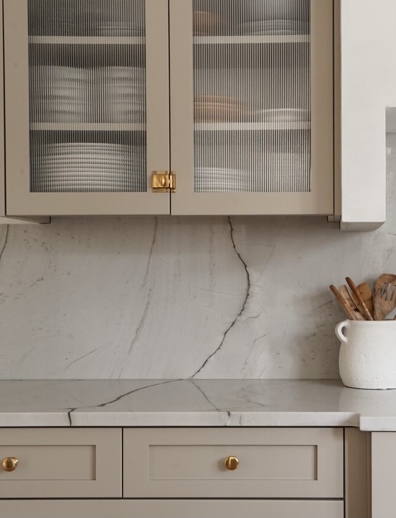 Close-up of matched veining from counter to backsplash in Colorado kitchen remodel