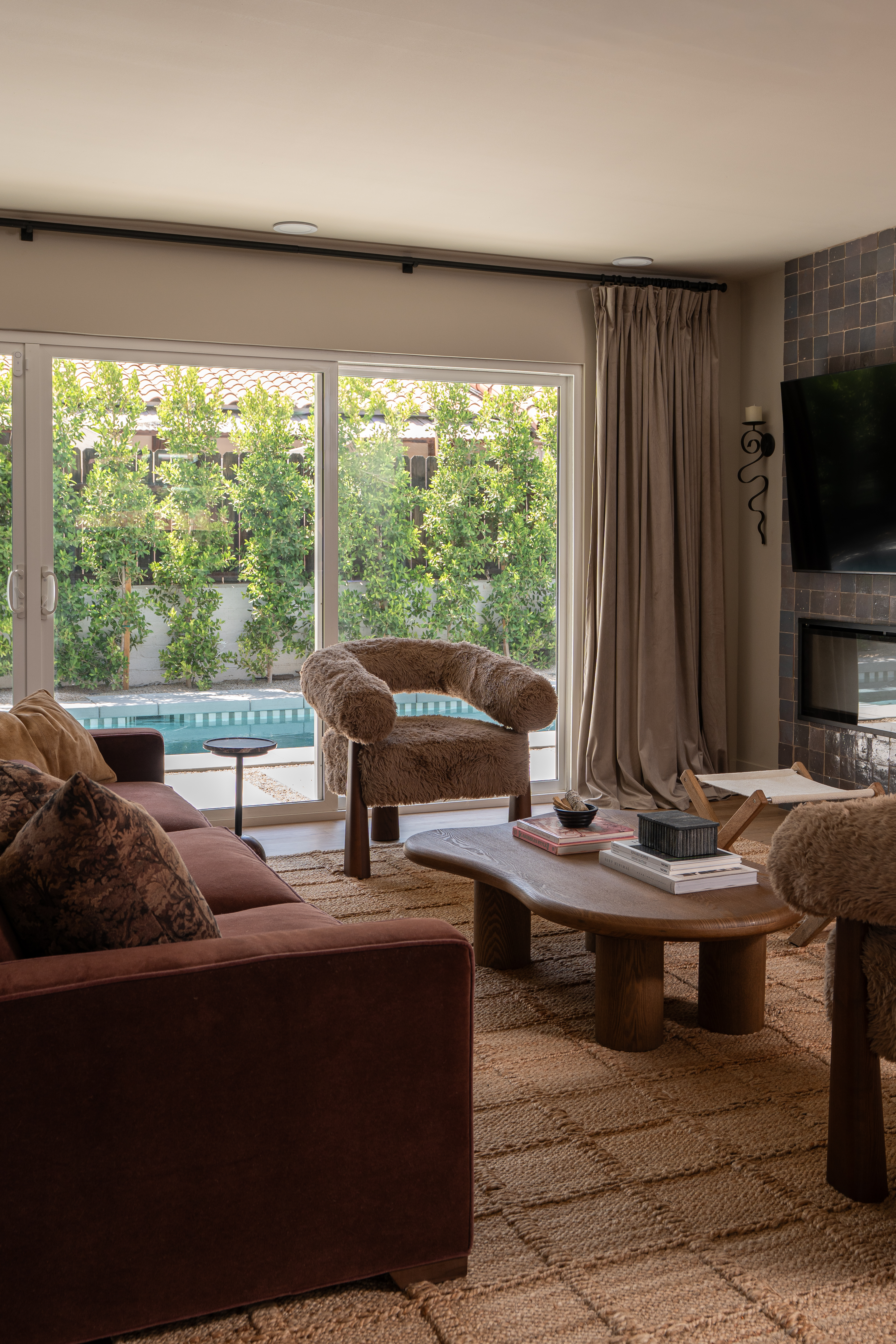 Palm Springs mid-century living room with warm plaster walls and collected furnishings by Halcyon Haus