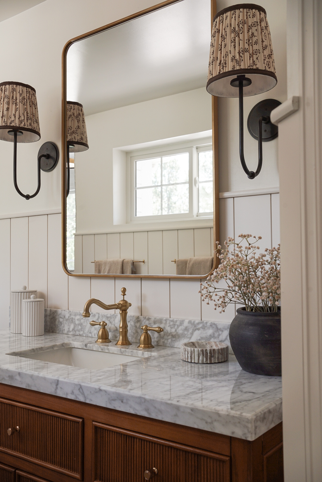 Castle Pines primary bathroom with marble vanity and warm natural materials by Halcyon Haus